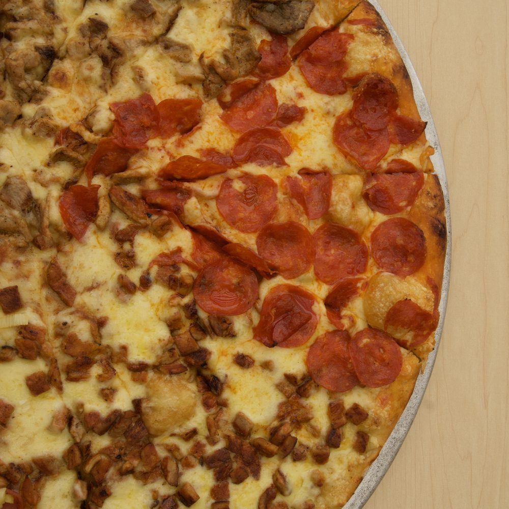 Pizza de jamón, piña y queso o pepperoni